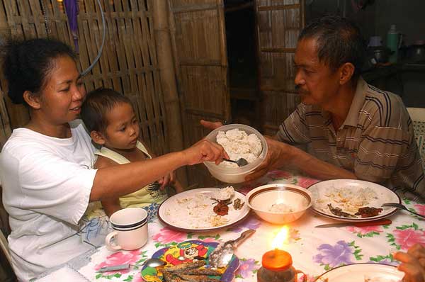 Filipinos eat an average of 123 kg of rice per person every year; for them a meal isn't a meal without rice.  (Photo: IRRI)