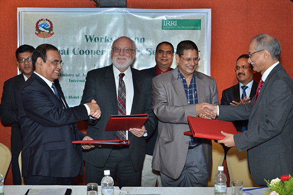 INDIA, BANGLADESH, Nepal, and IRRI seal the deal. From left, S.M. Nazmul Islam, Bangladesh; Robert Zeigler, IRRI director general; Jaya Mukunda Khanal, Nepal; and Ashish Bahuguna, India. (Photo: STRASA-Bangladesh)