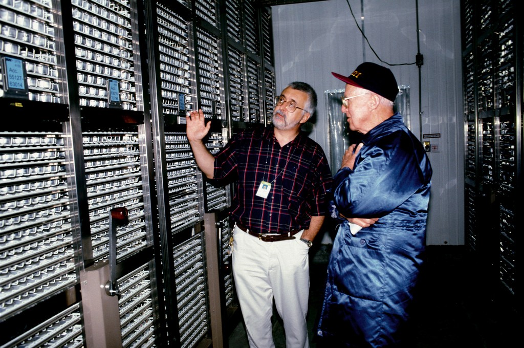 Oblivious to the cold, Dr. Jackson takes Nobel Tourist-Laureate Norman Borlaug on a walkthrough of the genebank’s large freezer during his 1999 visit to the Institute. (Photo: IRRI)