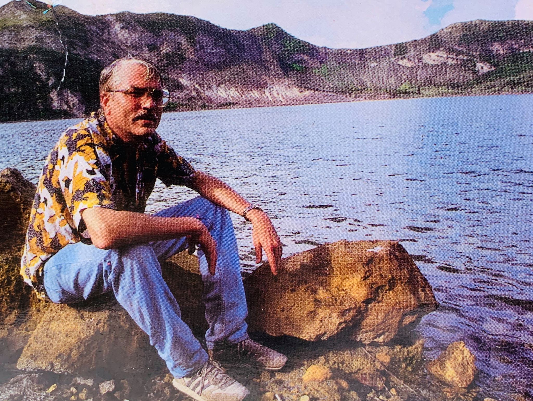 Tom Hargrove sitting beside his muse, the enigmatic Taal. The photo is featured in his book, The mysteries of Taal a Philippine volcano and lake, her sea life and lost towns. 